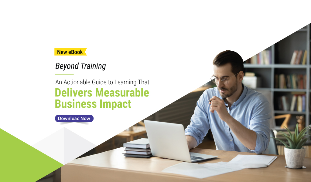 Man in glasses working on a laptop at a desk with documents and a plant, next to text promoting Upside Learning’s eBook “Beyond Training: An Actionable Guide to Learning That Delivers Measurable Business Impact,” with a Download Now button.
